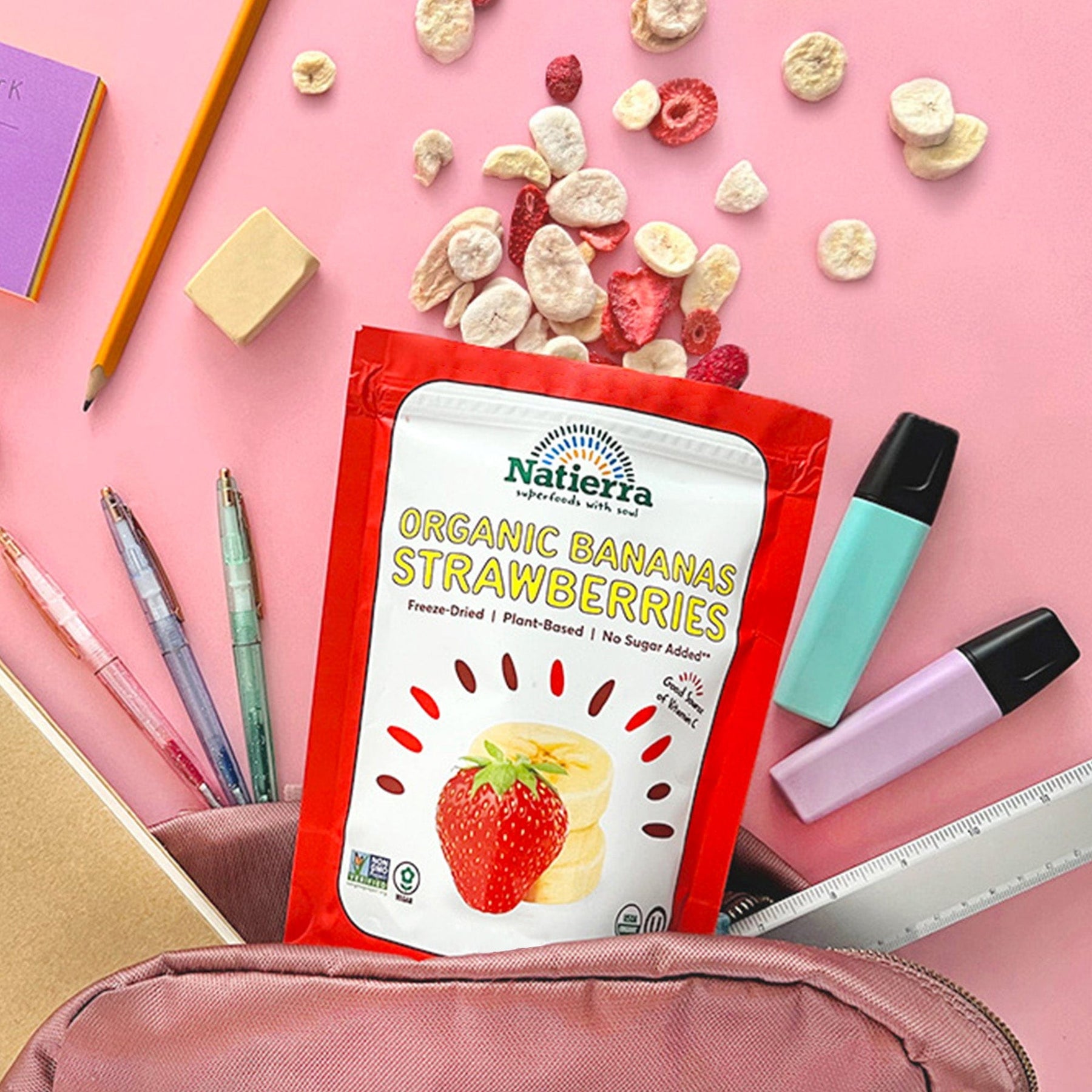 Natierra Freeze-Dried Bananas & Strawberries coming out of a backpack