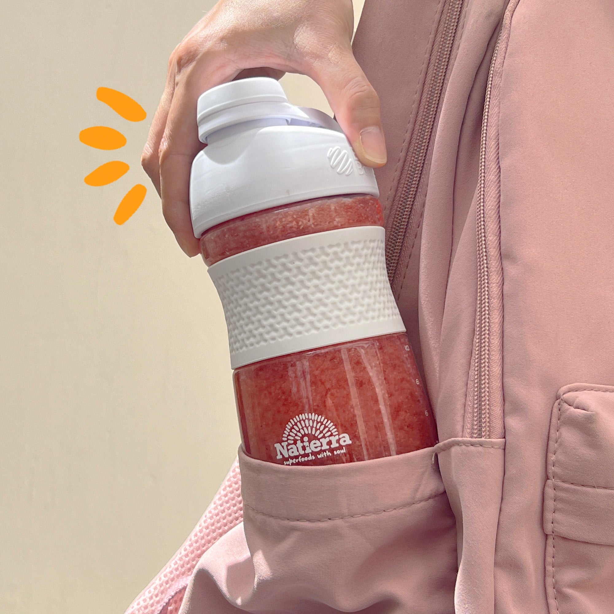 Smoothie shaker on the side of a backpack bag