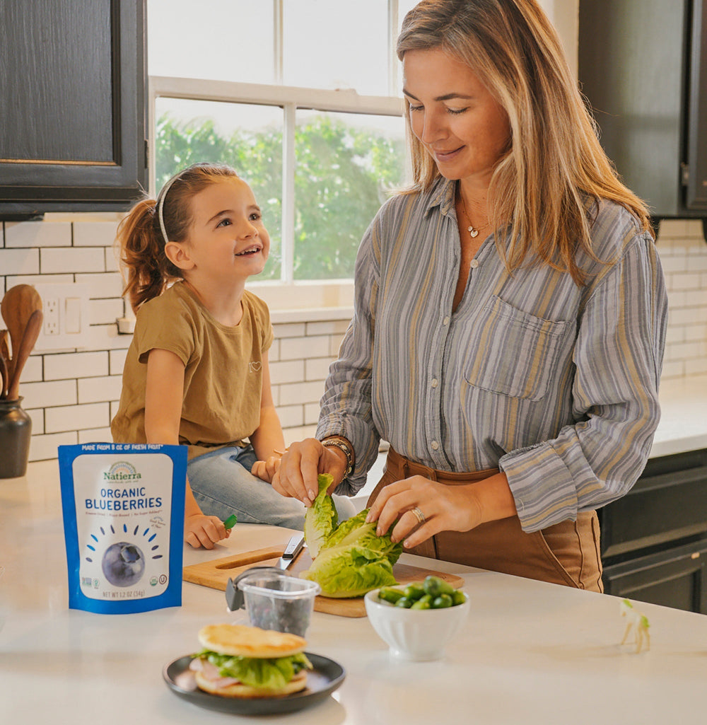 A girl and a women preparing for breakfast