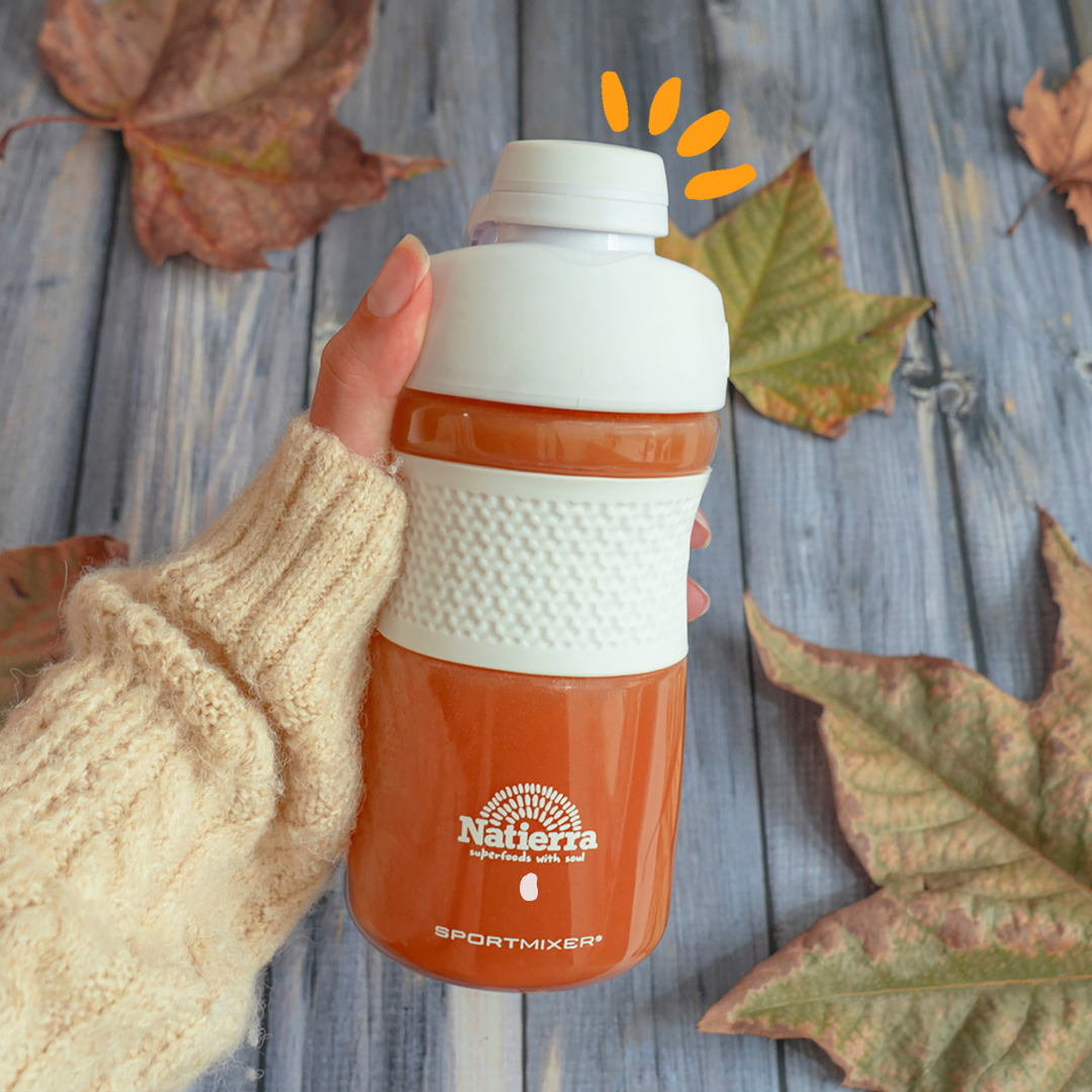 bright boos smoothie in shaker with fall leaves background