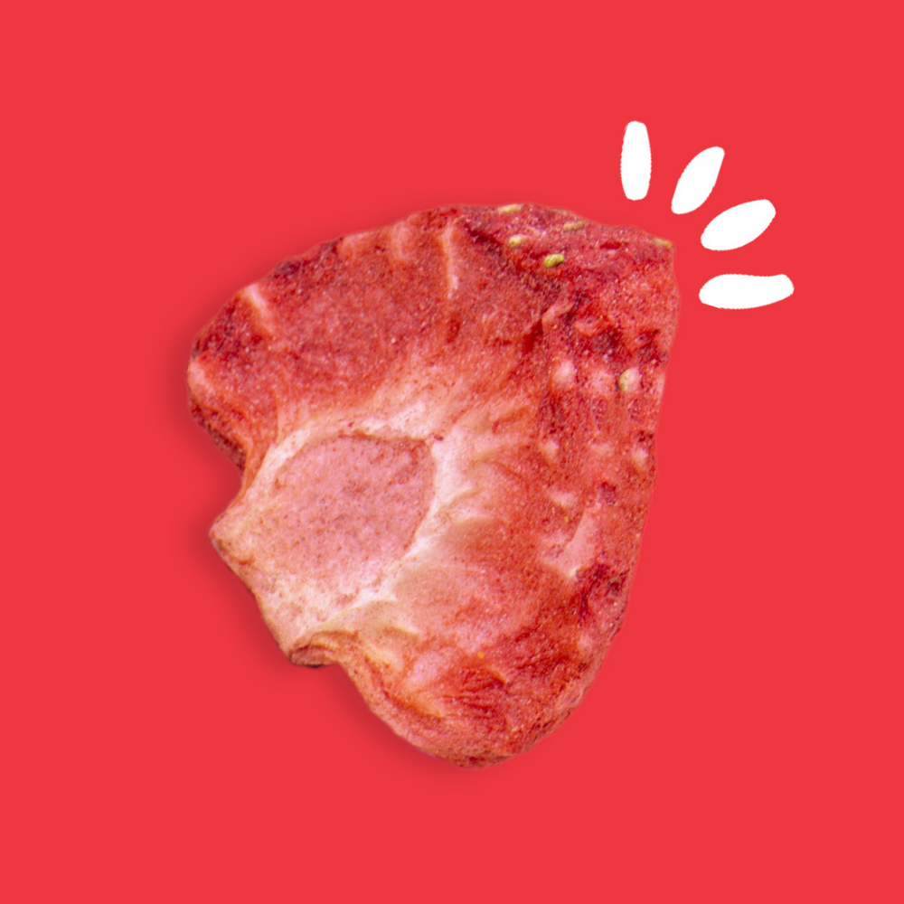 Freeze-dried strawberry piece on a red background