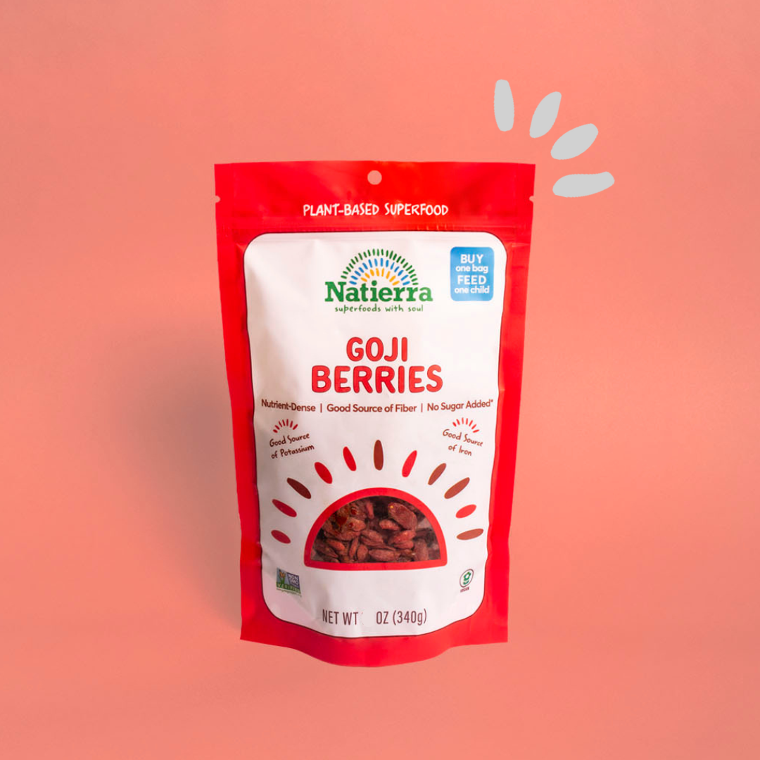 Goji berries bag on a coral background