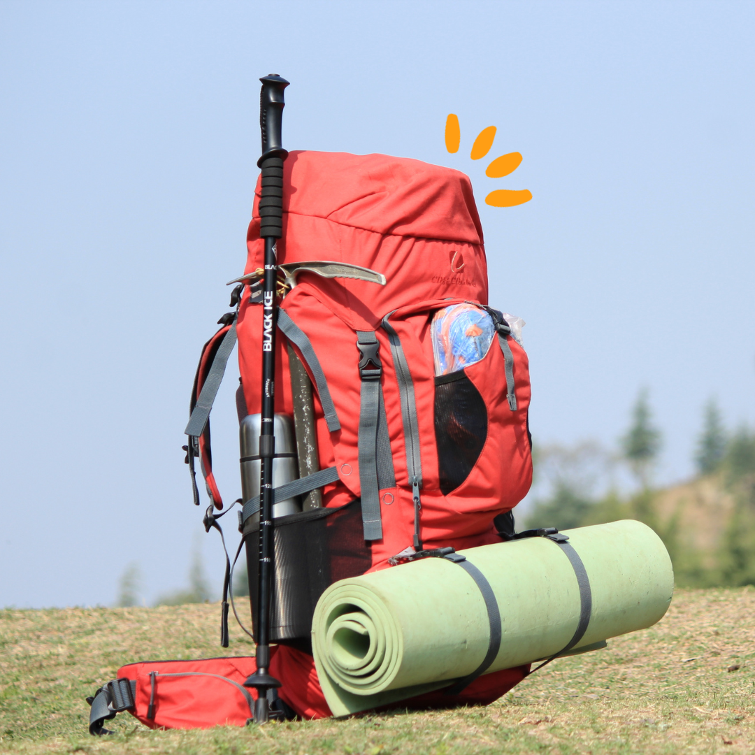 A back pack on a hill for hiking on a sunny day
