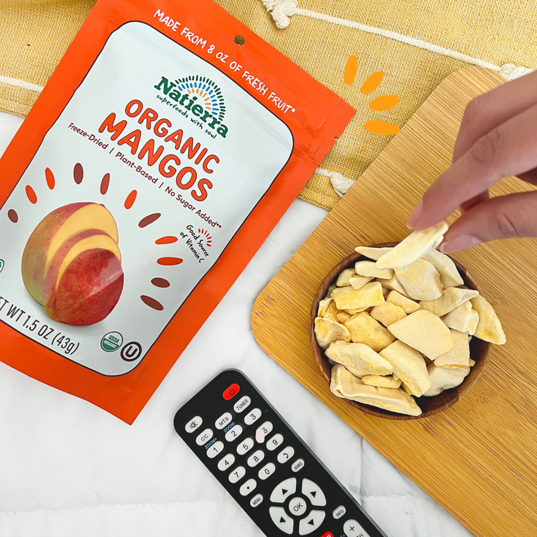 organic freeze dried mango bag next to tv remote control